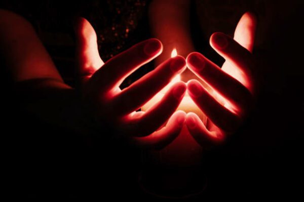 cupped around a flame, Order of Bards, Ovates & Druids.